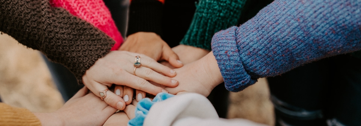 Collection of hands in a circle