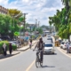 Man on bike riding on a street